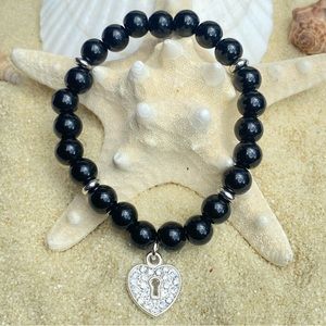 Beaded bracelet - black obsidian, silver tone accents and heart charm